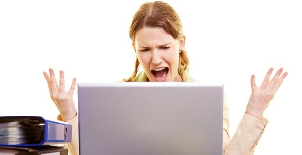 Woman screaming at her laptop