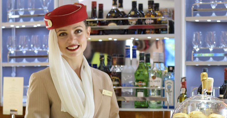 Emirates_flight_attendant_in_the_Airbus_A380_bar-1024x471